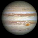 How many times is Jupiter's volume larger than Earth's volume?