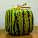 In which country are watermelons grown in a specific cube shape?